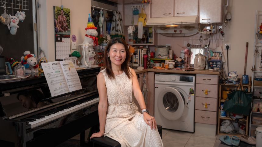 Iman Lau, 50, poses for a picture at her apartment in Hong Kong.