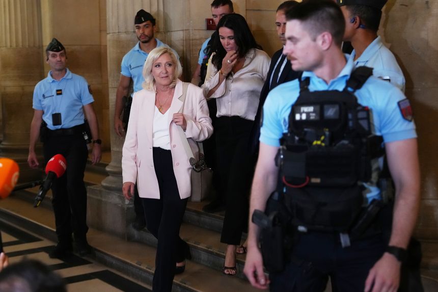 Marine Le Pen leaves the courtroom after the verdict of her appeal trial, in Paris, on July 7.