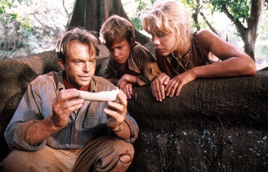 Sam Neill in a scene from the film "Jurassic Park" with Joseph Mazzello and Ariana Richards.