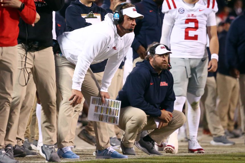Ole Miss Rebels head coach Lane Kiffin, left, and defensive coordinator Pete Golding, right, watch during the second half of a game against the Mississippi State Bulldogs in Starkville, Mississippi, on November 23, 2023.