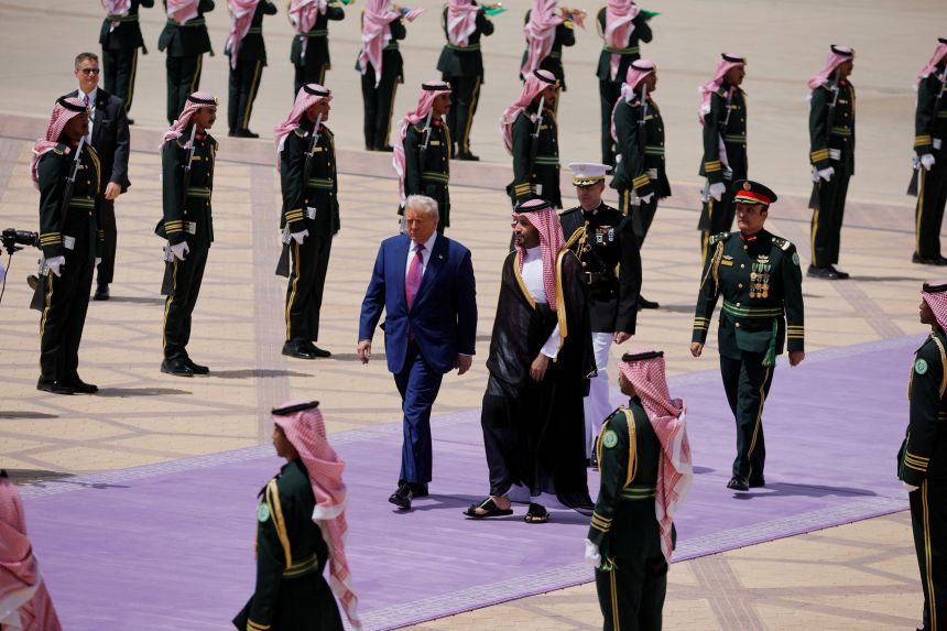 President Donald Trump and Saudi Crown Prince Mohammed Bin Salman walk as he arrives at King Khalid International Airport in Riyadh, Saudi Arabia, May 13.