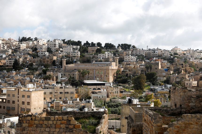 2026-04-21t111409z-1498619302-rc2itka04s5a-rtrmadp-3-israel-palestinians-settlers-1 Isaeli flags flutter on the Ibrahimi mosque, also known as the Cave of the Patriarchs, in Hebron, in the Israeli-occupied West Bank, on April 21.