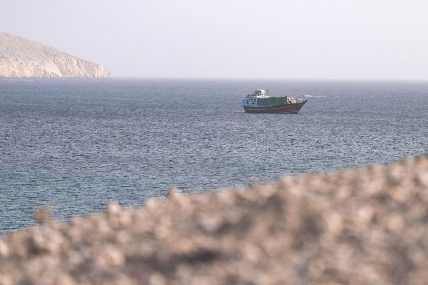 2026-07-16t063055z-845135880-rc2rema7t02v-rtrmadp-3-iran-crisis-oman-hormuz A vessel in the Strait of Hormuz, as seen from Musandam, Oman, on July 16.