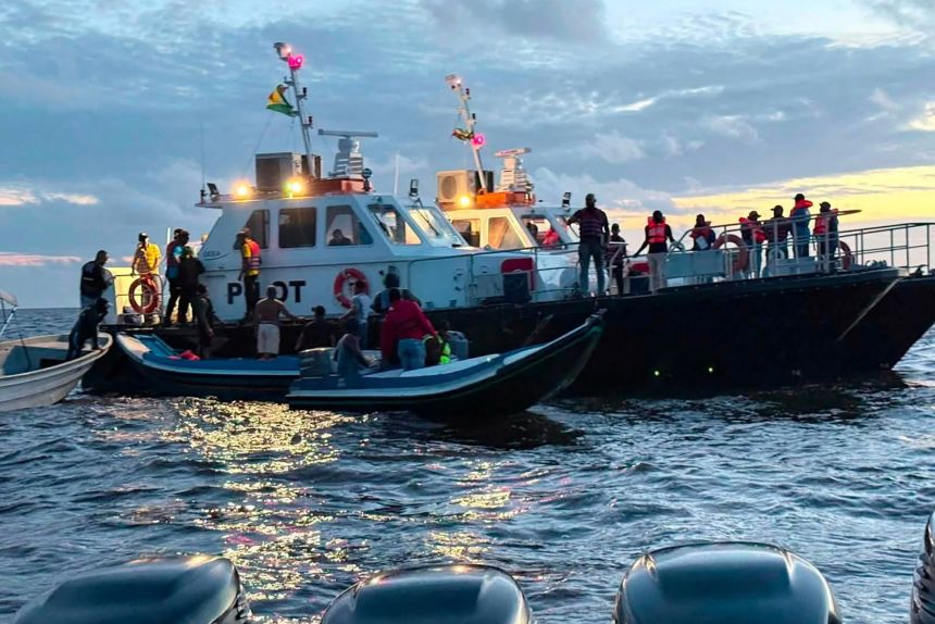 Rescue workers search for passengers who went missing after the MV Barima capsized off the coast of Guyana in South America late Saturday.