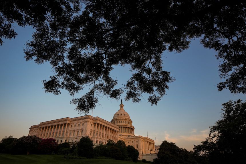 Sunlight falls on the US Capitol as the sun sets in Washington, DC, on July 13.