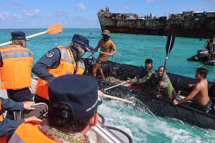 2026-07-21t022904z-99933727-rc2dhmajezpo-rtrmadp-3-southchinasea-philippines-china Personnel from the Philippine Navy and China Coast Guard clash near a grounded Philippine warship at Second Thomas Shoal in the South China Sea on July 20, 2026.