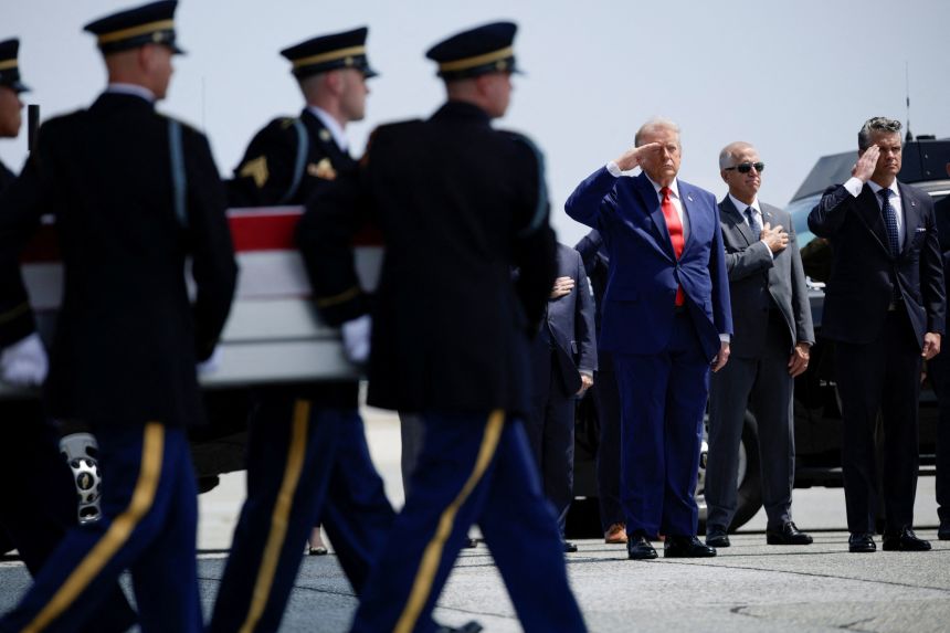 US President Donald Trump and U.S. Secretary of Defense Pete Hegseth salute as members of the military carry the transfer case of U.S. Army 1st Lt. Tyler James Feehan of the 2nd Battalion, 55th Air Defense Artillery Regiment, 32nd Army Air Missile Defense Command, who was killed during an attack at Muwaffaq Salti Air Base in Jordan, during a dignified transfer of his remains at Dover Air Force Base in Dover, Delaware, on July 22, 2026.