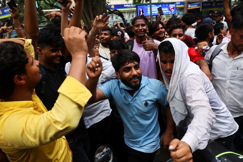 Supporters of India's Cockroach Janta Party  celebrate in New Delhi after India’s Education Minister Dharmendra Pradhan resigned.