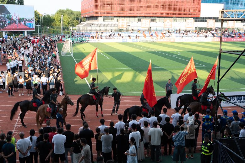202607018-fh-dsc03810 Horseback riders lead the opening parade for the final on July 18.