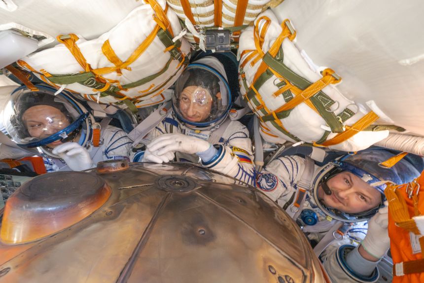 From left, NASA astronaut Chris Williams, Roscosmos cosmonaut Sergey Kud-Sverchkov, and Roscosmos cosmonaut Sergei Mikaev are seen inside the Soyuz MS-28 spacecraft after they landed in a remote area near the town of Zhezkazgan, Kazakhstan on Sunday.