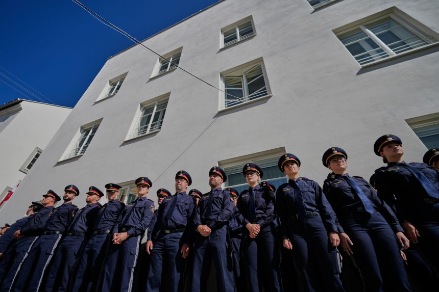 Austrian police officers stand in front of a new police station in the house where Adolf Hitler was born. The building in Braunau am Inn officially reopened on July 22, 2026.