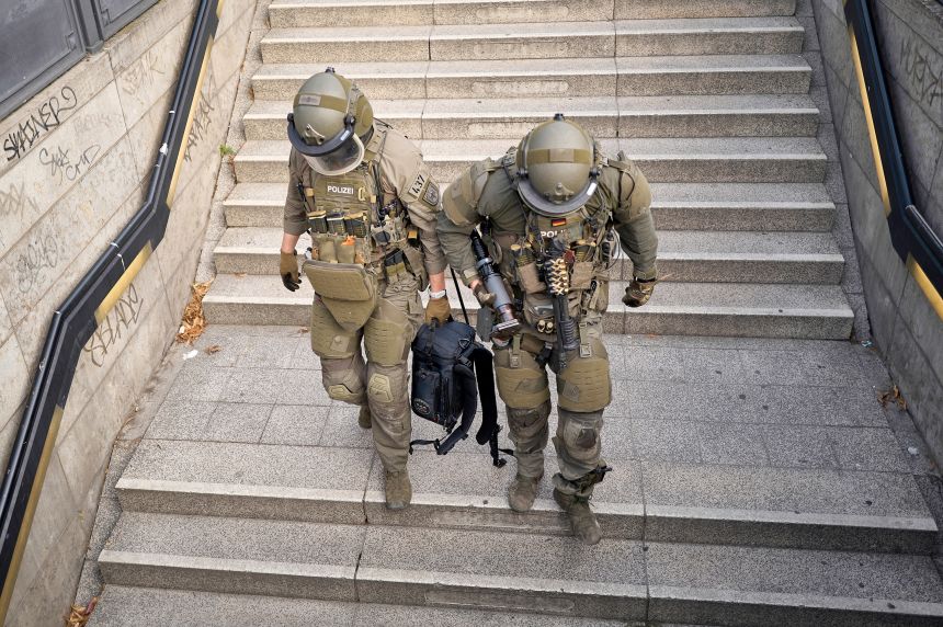 Armed police special forces are seen near the sealed entrance to the Anhalter Bahnhof S-Bahn station in Berlin on Sunday.
