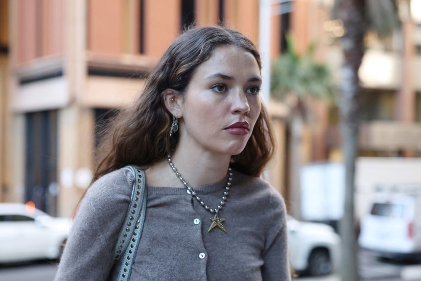 c-2026-04-28t042823z-1015489752-rc24ykayhh3j-rtrmadp-3-australia-court-wilson-1 Actor Charlotte MacInnes outside a Sydney court during the defamation hearing.