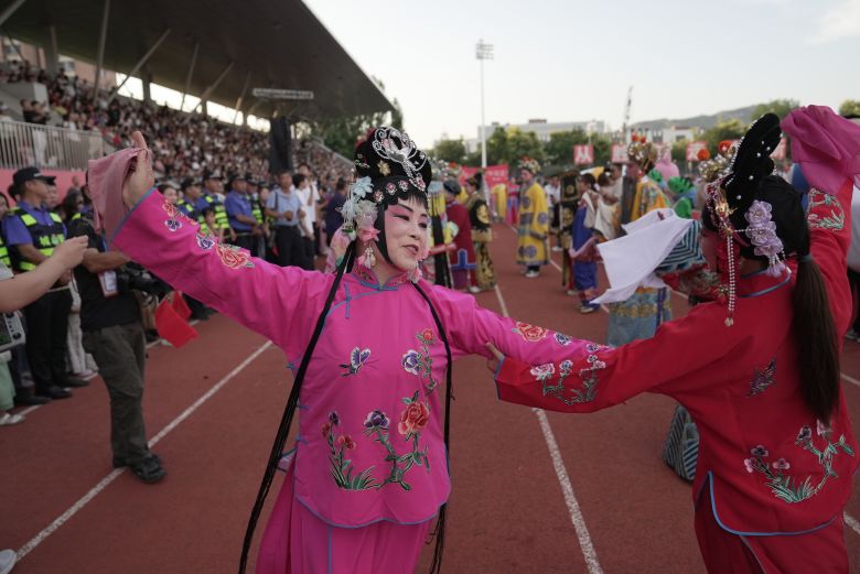 dsc02528 Performers dance ahead of kickoff at the Fuping county Village Super League final. Steve Wang/CNN