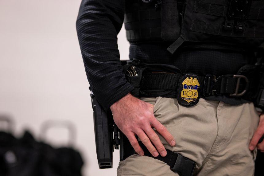 A Bureau of Alcohol, Tobacco, Firearms and Explosives agent attends a meeting with other federal law enforcement agencies, related to immigration enforcement, in Chicago on January 26, 2025.
