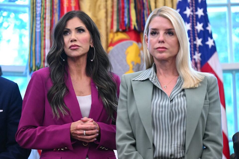 Secretary of Homeland Security Kristi Noem, left, and US Attorney General Pam Bondi listen to President Donald Trump, not pictured, as he signs an order in the Oval Office of the White House on September 15, 2025. Both Cabinet-level secretaries have since left their positions.