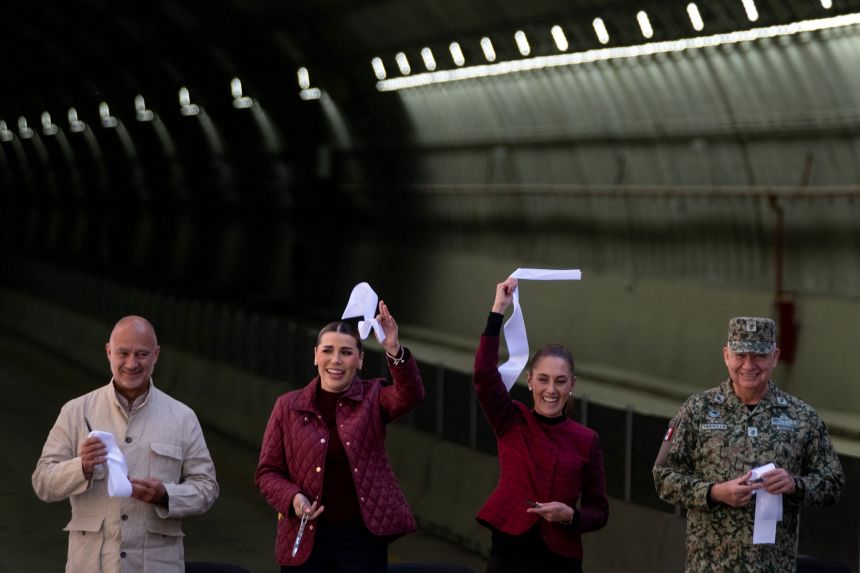 Mexico's President Claudia Sheinbaum, center right, waves a ribbon next to Baja California Governor Marina del Pilar Avila Olmeda on January 30.