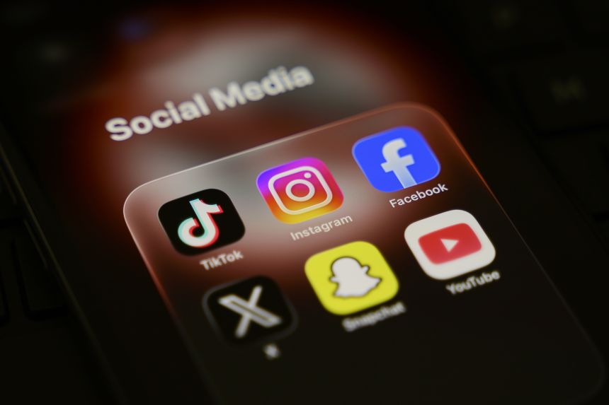 gettyimages-2268682292 A smartphone displays a folder of social media applications, including TikTok, Instagram, Facebook, X, Snapchat, and YouTube, in Creteil, France, on March 31, 2026.