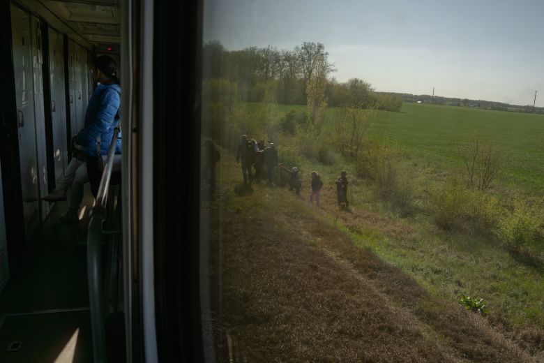 gettyimages-2274654346 Passengers from the evacuated Lviv–Dnipro train return to their seats after the Russian drone attack threat ended.
