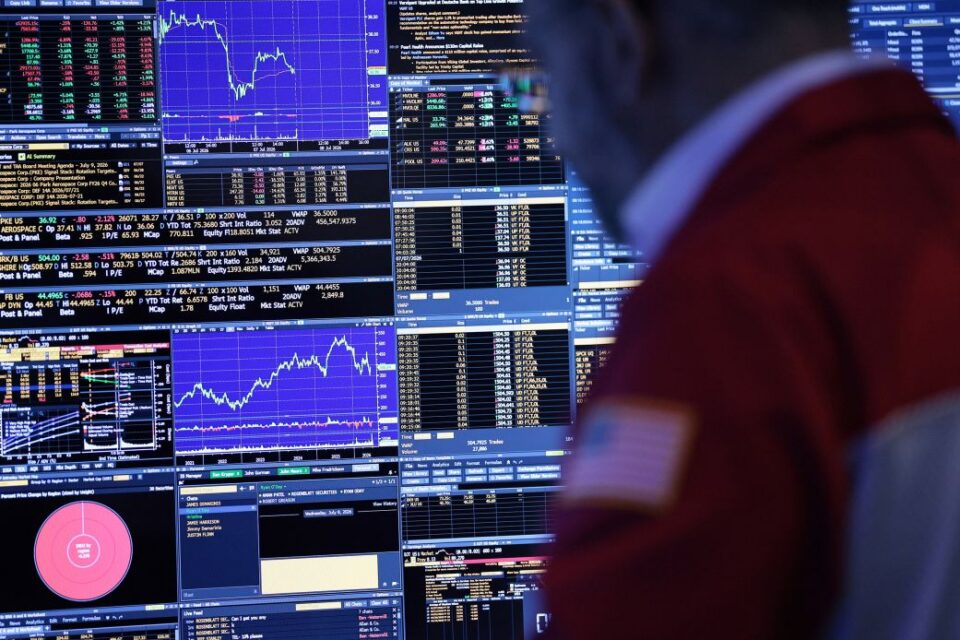 Traders work on the floor of the New York Stock Exchange on July 8.