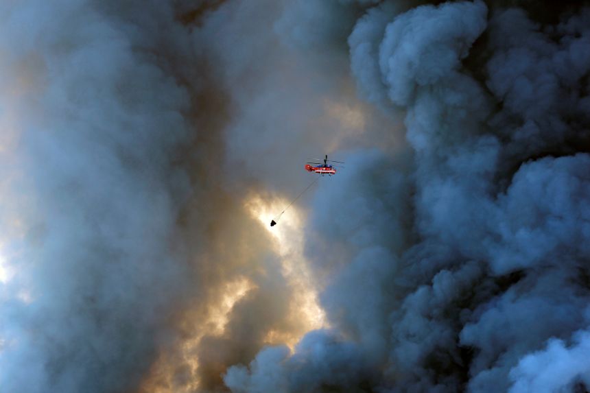 gettyimages-2285991519 A firefighting helicopter attempts to extinguish a fire at the Russian e-commerce firm Wildberries' logistics complexes in the town of Elektrostal outside Moscow on July 18.