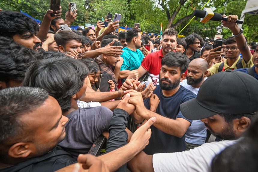 Cockroach Janata Party founder Abhijeet Dipke during sit-in protest at Jantar Mantar demanding resignation of India's education minister on July 21, 2026, in New Delhi.