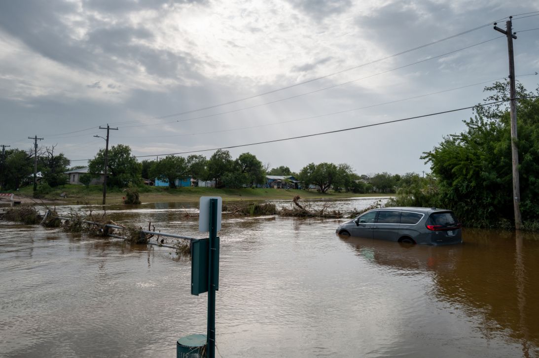 A vehicle sits in floodwater on July 17, 2026 in Uvalde, Texas.