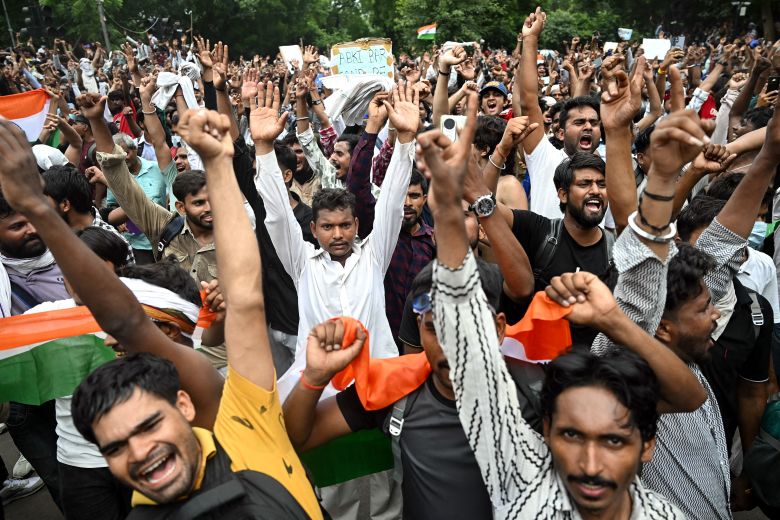 Wild scenes of celebration in India's capital on Saturday after Dharmendra Pradhan announced he would resign as education minister.