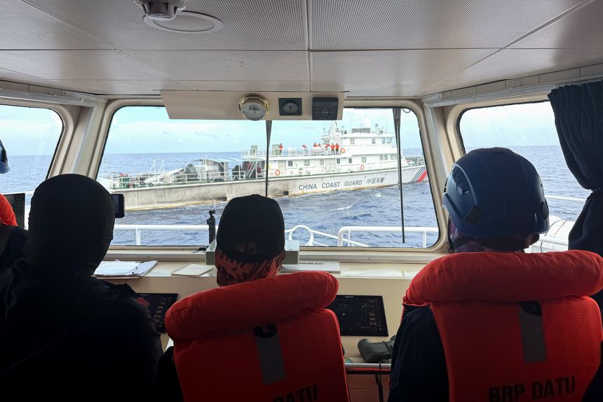 A China Coast Guard vessel is seen from a Philippine vessel near Scarborough Shoal in the South China Sea on July 24, 2026.