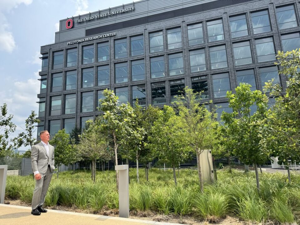 Biotech entrepreneur Michael Triplett is determined to make the Midwest a biotech hub. Here, he stands outside the Pelotonia Research Center in Columbus, Ohio, an integral part of turning his vision into reality.