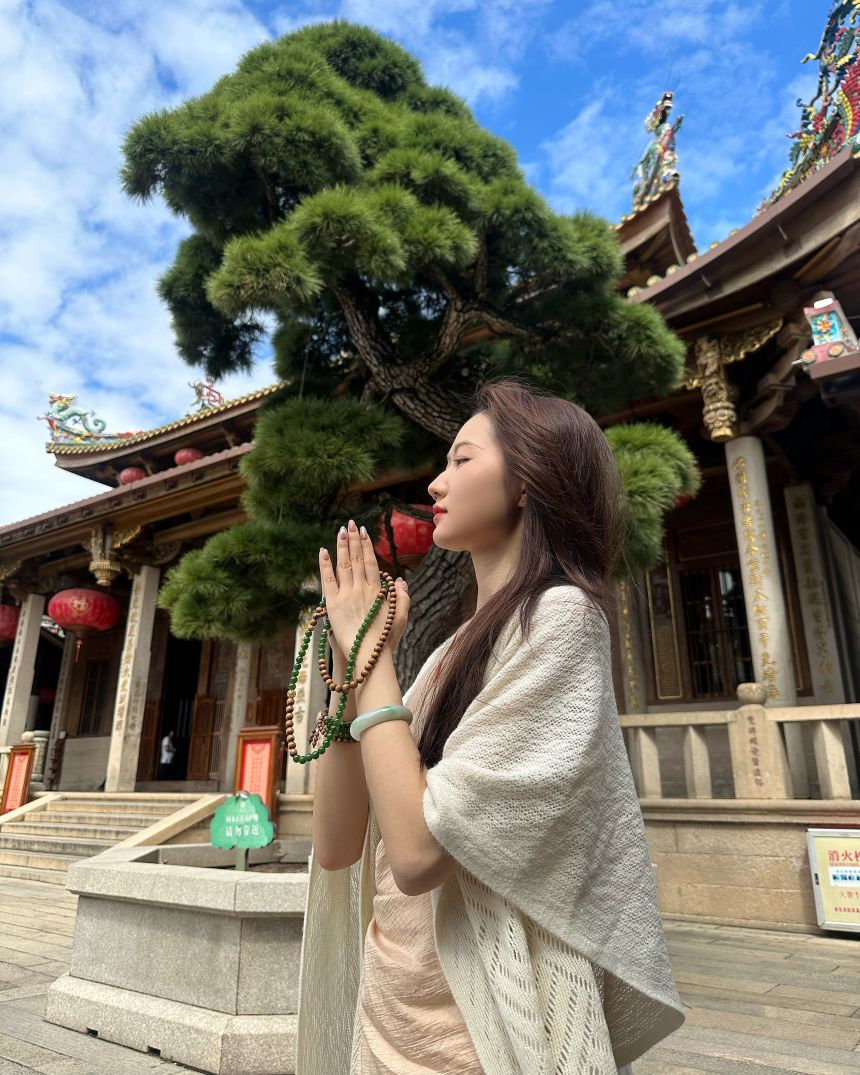 "These accessories are generally meant to serve as a form of emotional support," She Ze Lin said of the necklace she holds while praying for her career at a temple in Fujian province.