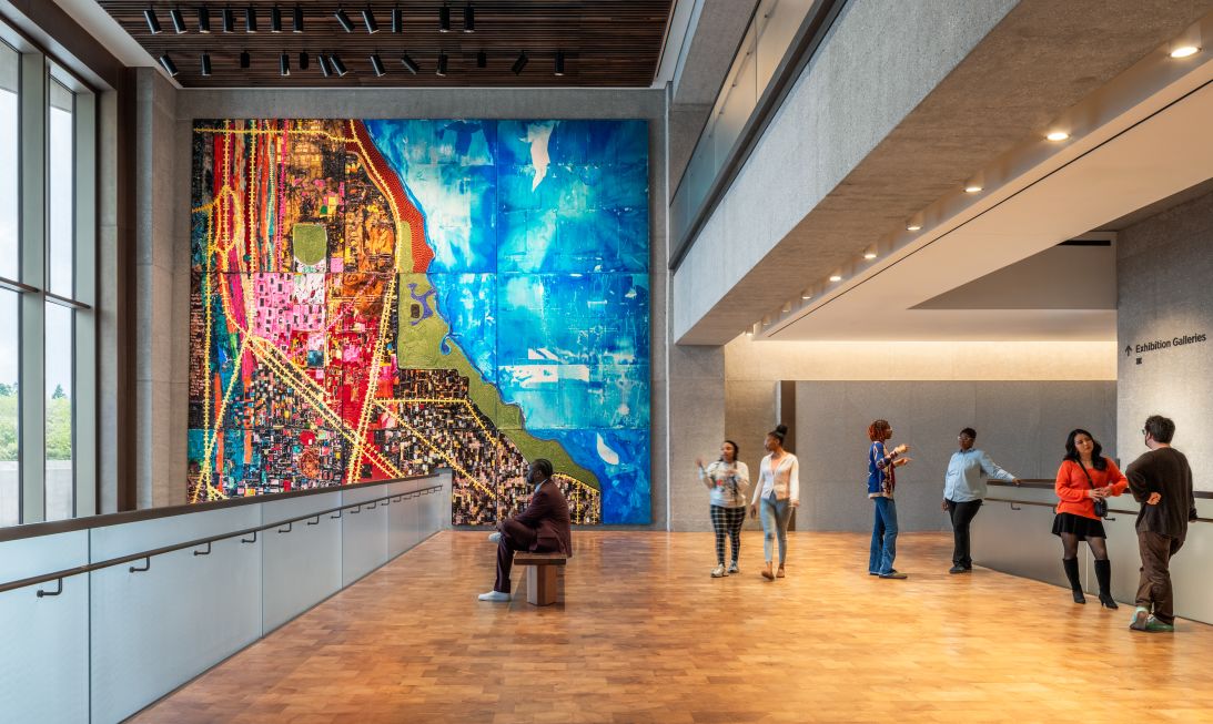 “City of the Big Shoulders” by Mark Bradford is one of the most prominent works in the museum, displaying a vibrant map of Chicago. But it also examines some of the inequitable practices, such as redlining, that have harmed the city.