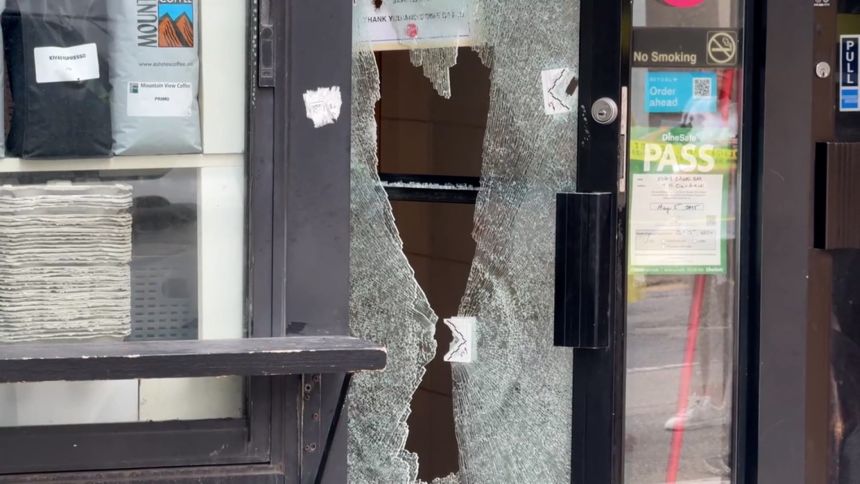 The glass door of Kiva's Bagel Bar was shattered in the attack.